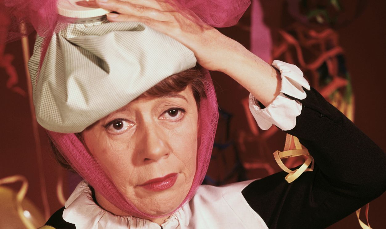 Imogene Coca Acting Hungover from New Years Party American television and film actress Imogene Coca, clowns around by playing 