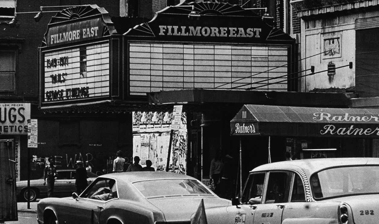 Exterior view of the Fillmore East theater, located at 2nd Avenue and East 5th Street, New York, New York, 1970s.