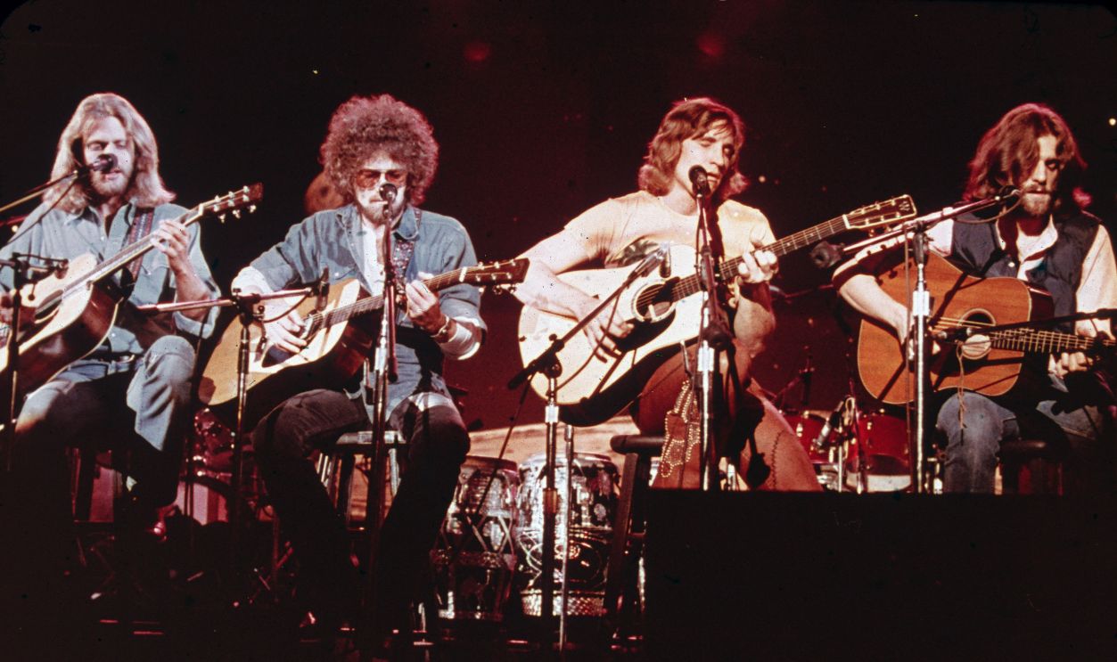 Members of the American soft-rock ensemble The Eagles sit on chairs as the perform on the television show 'Don Kirschner's Rock Concert,' 1979. Bandmembers are (left to right) Glenn Frey, Don Henley, Joe Walsh, and Don Felder. 