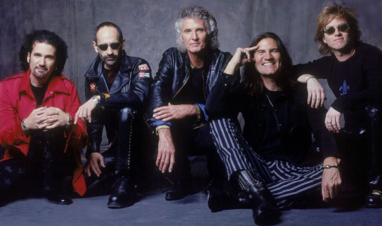 American blues rock band Grand Funk Railroad poses. 