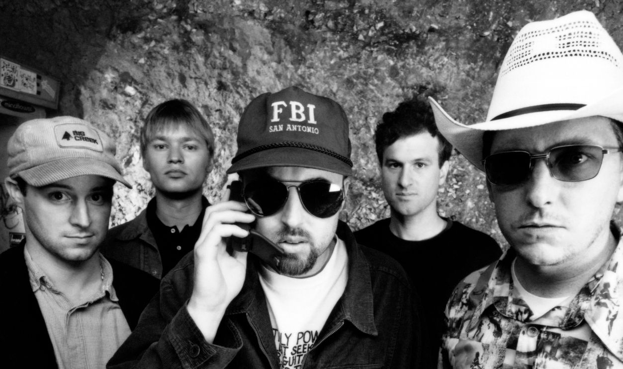 (L-R) Guitarist Todd Roper guitarist Xan McCurdy, lead singer John McCrea, bass guitarist Gabe Nelson and guitarist Victor Damaini, of the American alternative rock band CAKE, pose for a group portrait circa 1998 in San Francisco, California