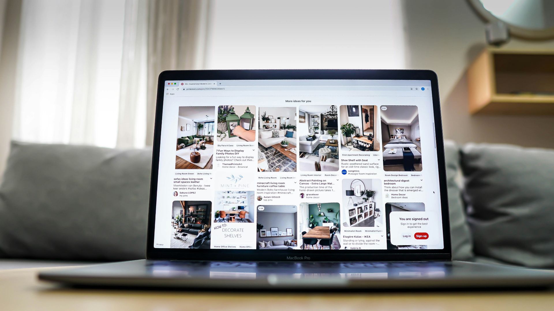 black ipad on brown wooden table