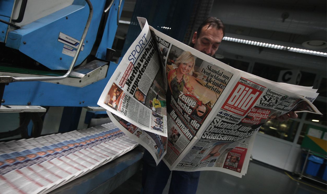 A printing press technician checks an issue of the Berlin-Brandenburg edition of Bild Zeitung tabloid at the Axel Springer printing press on January 10, 2012 in Berlin, Germany. Bild Zeitung, which is Germany's most influential and biggest-circulation tabloid, has pitted itself against German President Christian Wulff after the paper published a story about his personal finance conduct while Wulff was governor of Lower Saxony. Wulff has admitted telephoning Bild Editor-in-Chief Kai Diekmann before the story broke, though Wulff claims he only sought to postpone publication of the story by one day, and not prevent publication, as Bild alledges. The affair has since taken on further dimensions and many critics are calling for Wulff's resignation. 