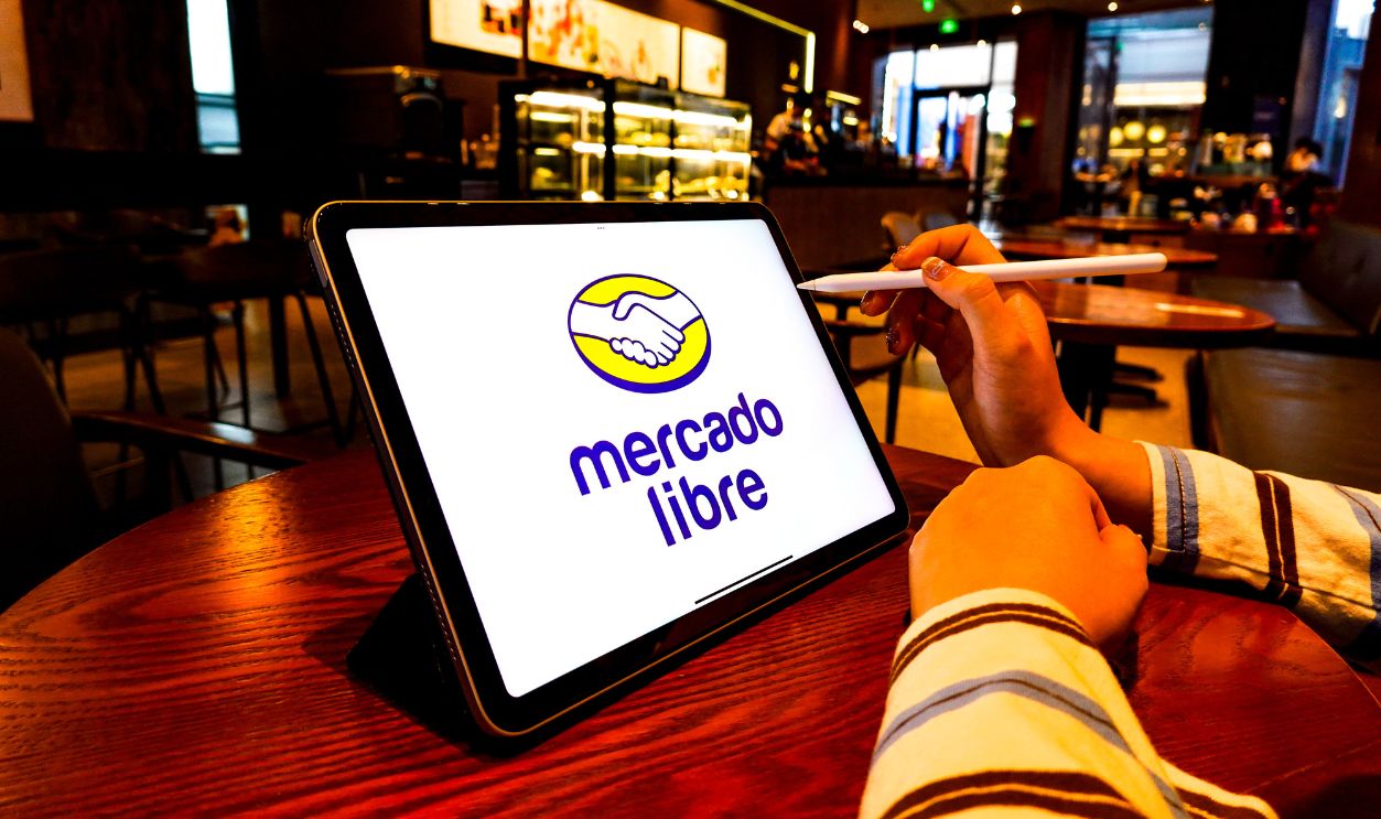  In this photo illustration, the MercadoLibre logo is displayed on the screen of an iPad. 