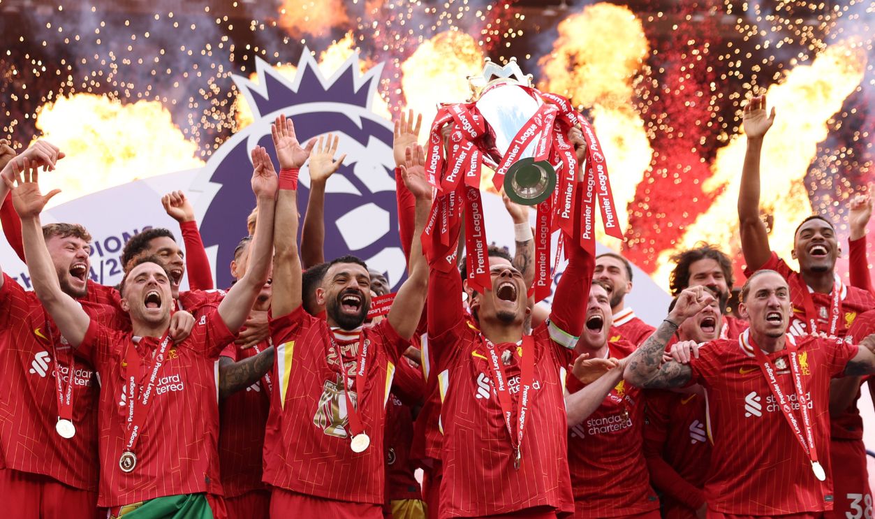 Virgil van Dijk of Liverpool, lifts the Premier League trophy, as Liverpool are crowned the Champions of the Premier League for the 2024/25 Season, following the Premier League match between Liverpool FC and Crystal Palace FC at Anfield on May 25, 2025 in Liverpool, England. 