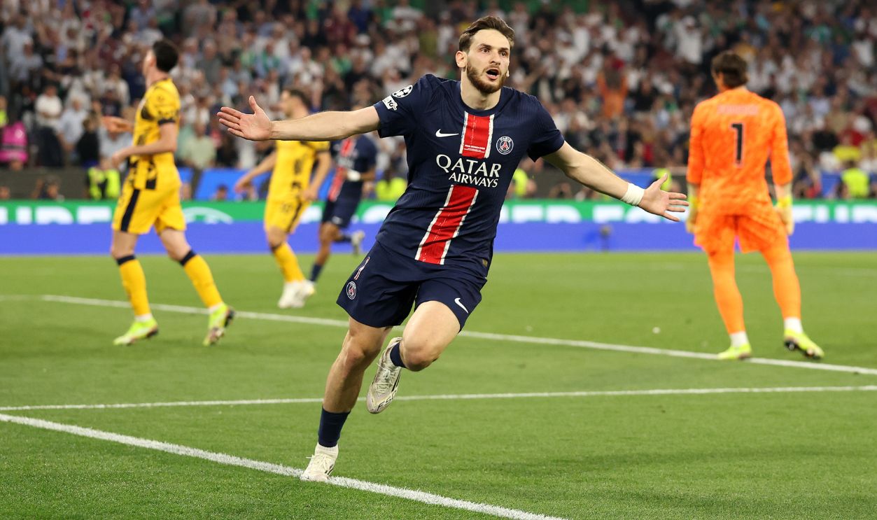 Khvicha Kvaratskhelia of Paris Saint-Germain celebrates scoring his team's fourth goal during the UEFA Champions League Final 2025 between Paris Saint-Germain and FC Internazionale Milano at Munich Football Arena on May 31, 2025 in Munich, Germany.