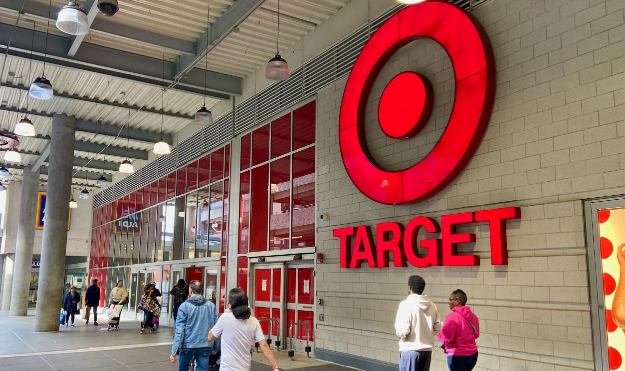  People walking in front of the facade and entrance of the Target store on the second floor of the East River Plaza shopping mall in East Harlem, New York City