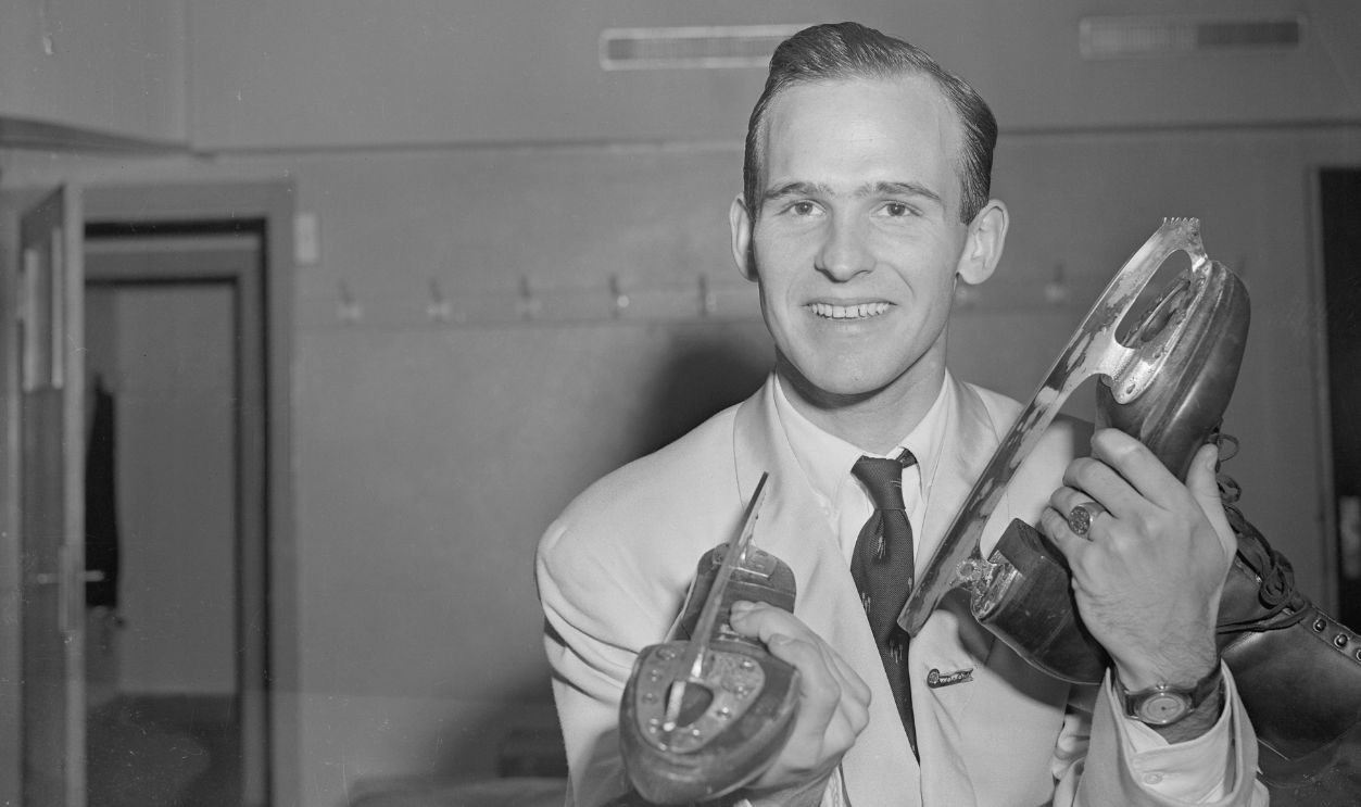 Figure Skater Dick Button Holding Skates