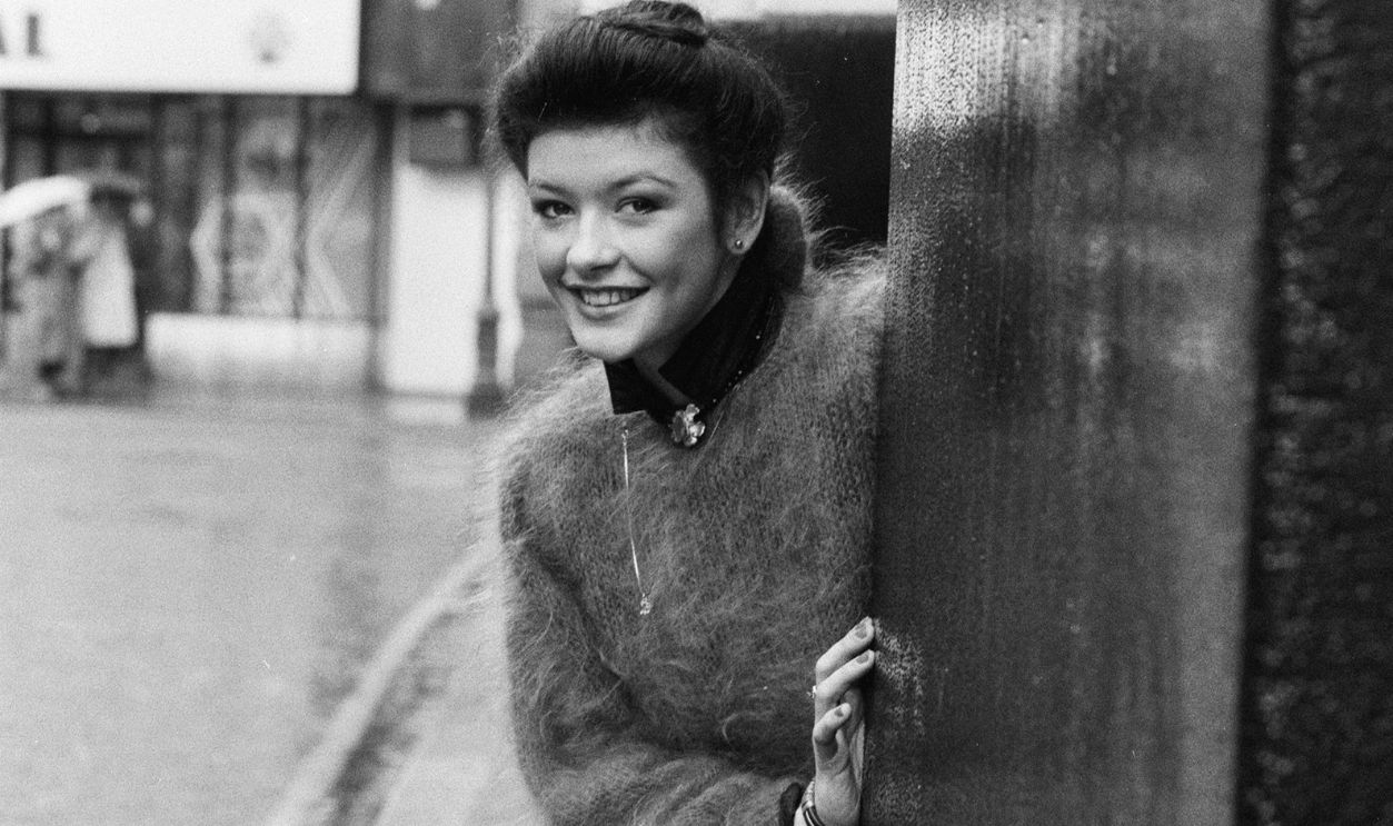 Catherine Zeta Jones 1987 Seventeen year old Welsh actress Catherine Zeta-Jones, who plays the lead role of Peggy Sawyer in the musical production 42nd Street, posing in a street in London's West End. The show will run at the Theatre Royal Drury Lane. 1st March 1987.