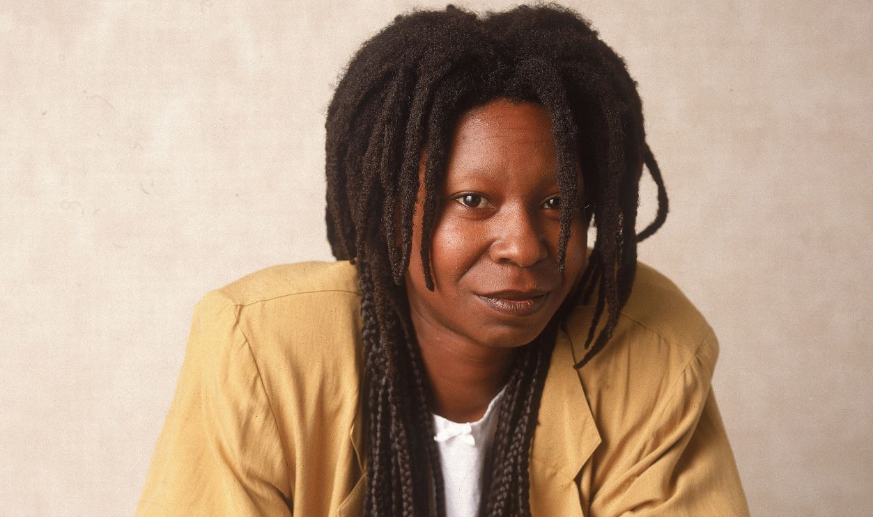 Whoopi Goldberg Studio portrait of American actor and comedian Whoopi Goldberg leaning on a chair, 1988.