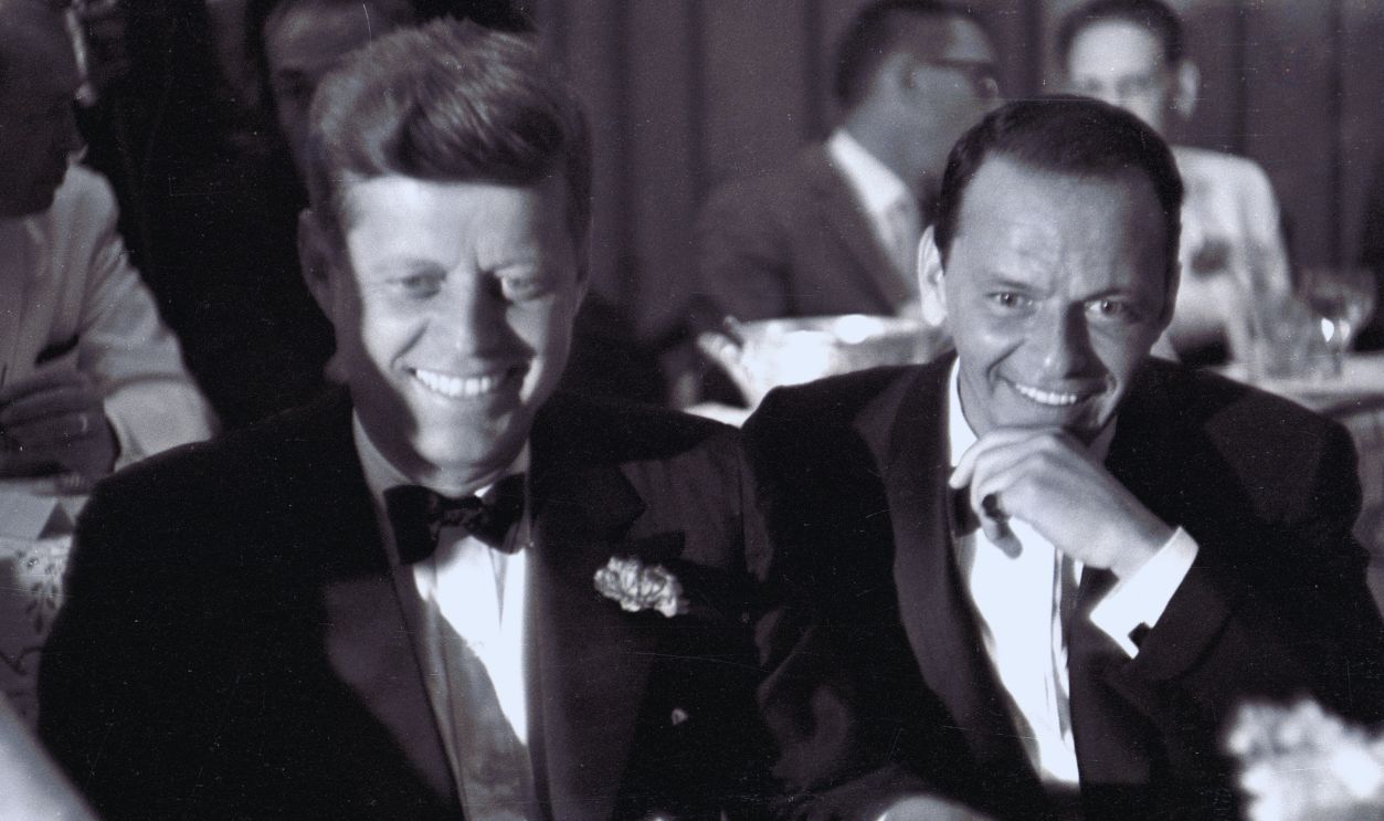 Gettyimages - 1353631356, Kennedy & Sinatra Attend A DNC Fundraiser US Senator (and future US President) John F Kennedy (1917 - 1963) (left) and entertainer Frank Sinatra (1915 - 1998) attend a black tie, Democratic Committee Dinner at the Beverly Hilton Hotel, Los Angeles, California, July 10, 1960.