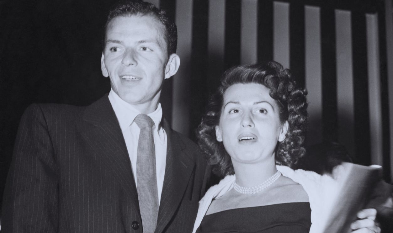 Gettyimages - 514896646, Frank Sinatra Posing with Wife (Original Caption) With Hollywood film stars after dark...Frank Sinatra and his own wife, Nancy, about to enter Ciro's night club in Hollywood, where film stars sometimes go to night clubs with their own wives.