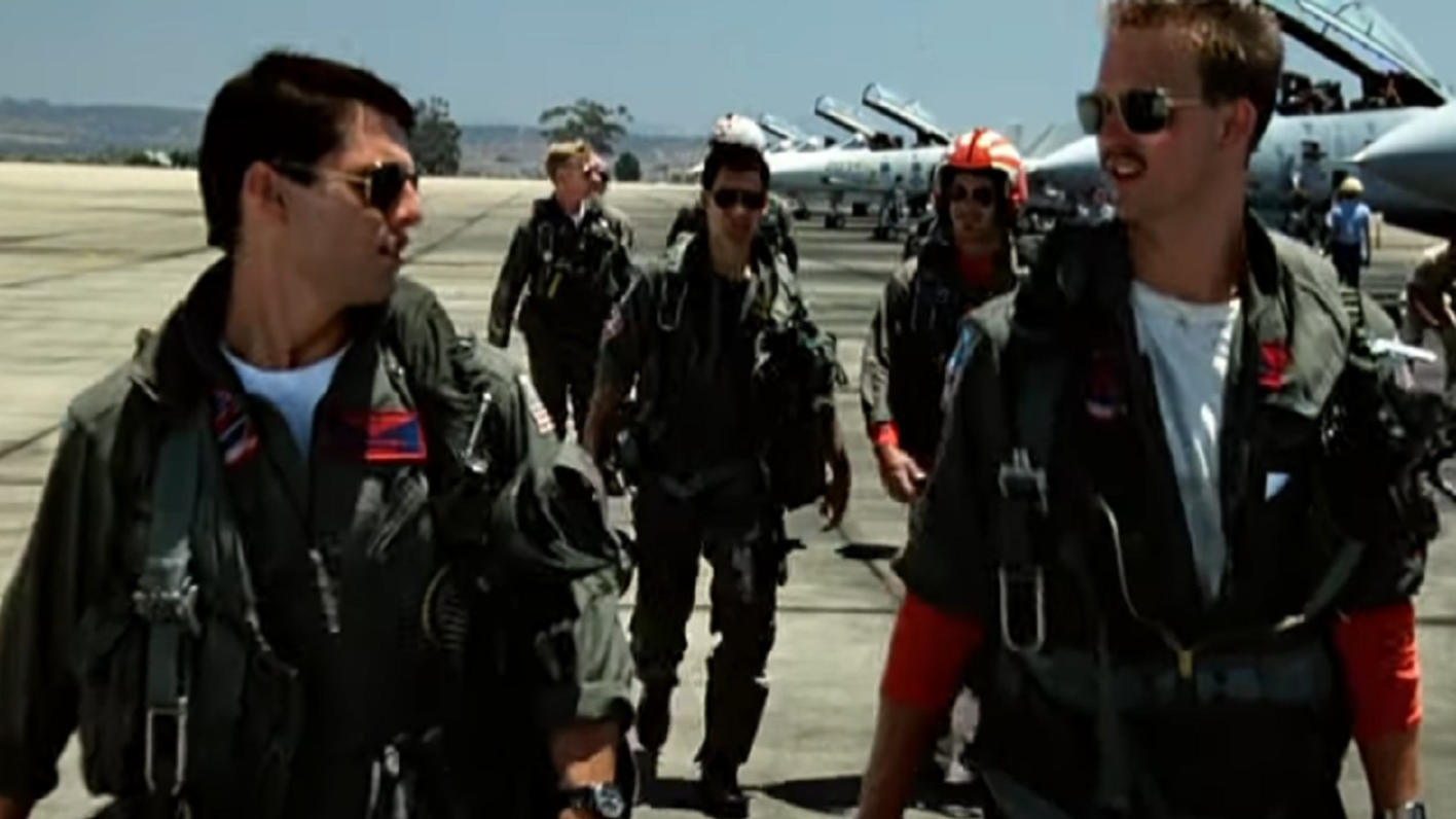 Screenshot of Tom Cruise looking at side  - from Top Gun (1986)