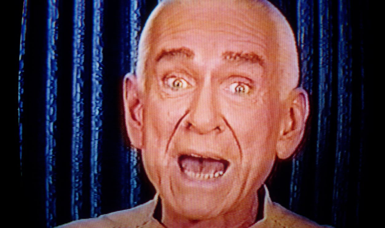 Marshall Herff Applewhite (1931 - 1997) also known as Do, founder and co-leader of the religious cult, Heaven's Gate, speaks to his followers via television, 1996.