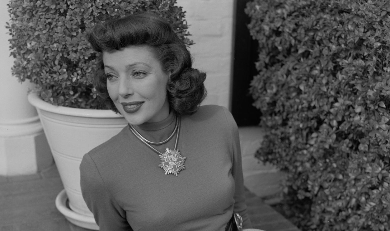 American actress Loretta Young wearing a large pendant necklace, circa 1950. 