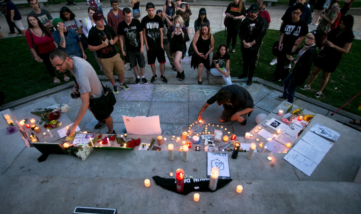 Candles are lit during a fan-created memorial for the late Chester Bennington, the lead singer of the popular punk band Linkin Park, at the Boston Common on July 30, 2017. The week prior Bennington was found to have killed himself.