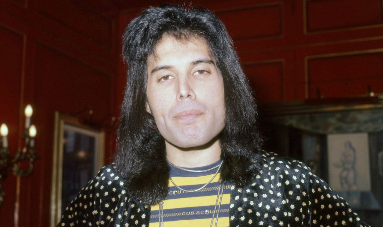 View of English Rock & Pop singer Freddy Mercury (born Farrokh Bulsara, 1946 - 1991), of the group Queen, at Les Ambassadeurs Club, London, England, September 8, 1976. He was there for the presentation of Silver, Gold, & Platinum records for sales related to the group's 'A Night at the Opera' album and its lead single, 'Bohemian Rhapsody'.