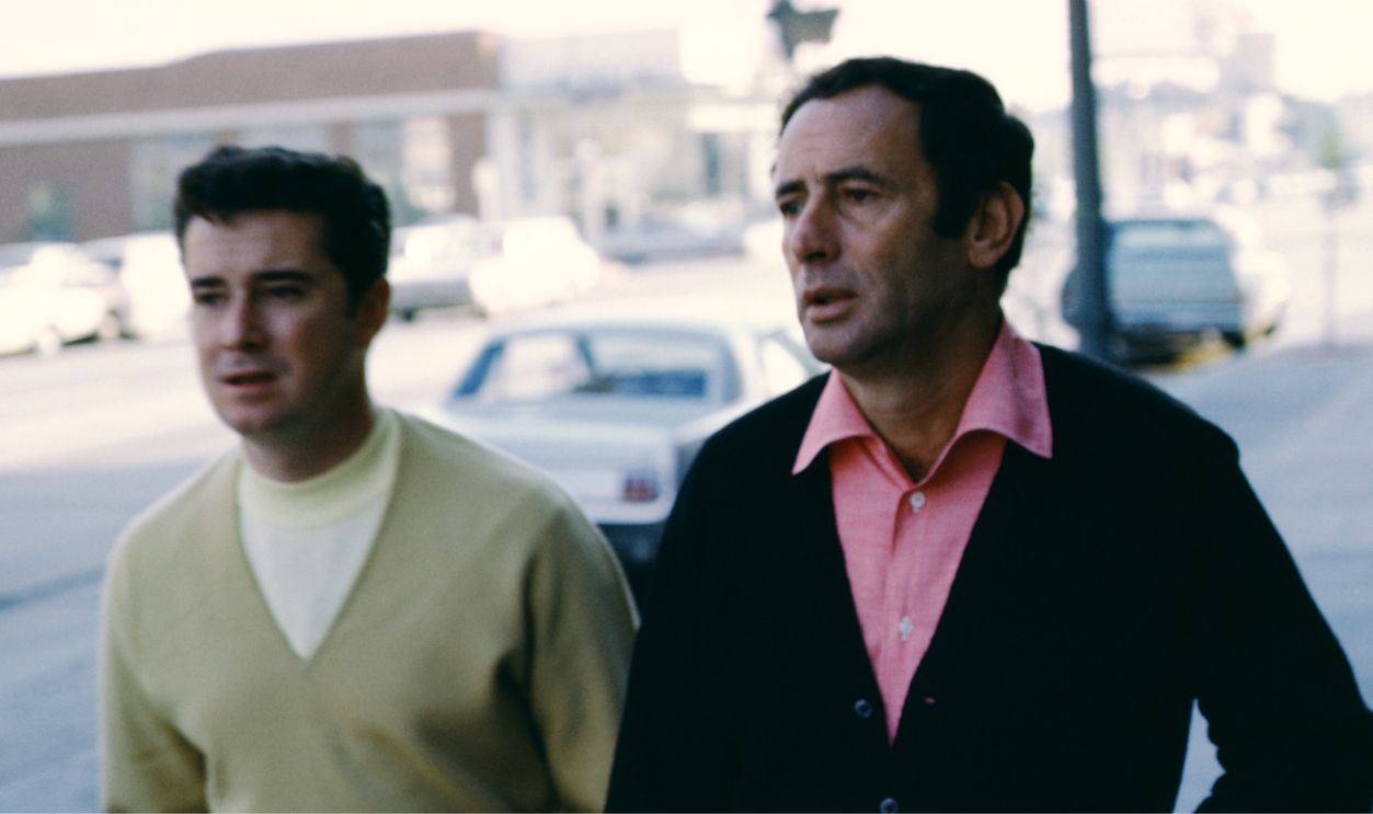 Talk show hosts Regis Philbin and Joey Bishop walk on the street before taping 