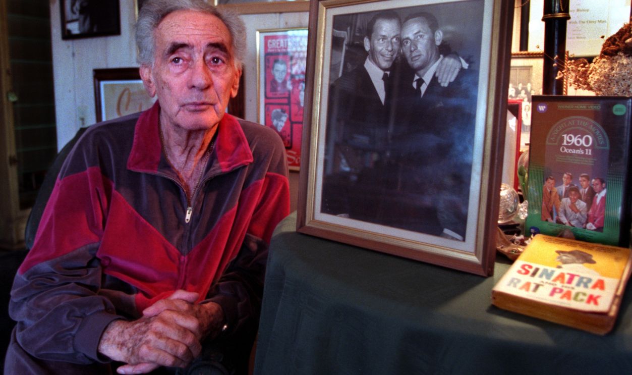 AA.joey.bishop.0515.ASNEWPORT BEACHRat Pack member Joey Bishop pours over fond memories of his good friend Frank Sinatra, who died of a heart attack Thursday evening, at his Newport Beach home Friday. At center is a photograph of Sinatra, left, and Bishop taken in 1961 at the Sands Hotel. 