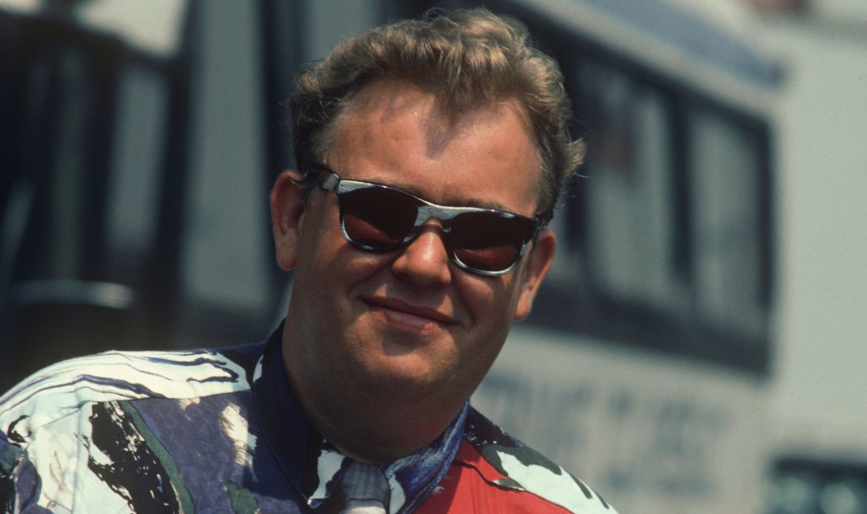 John Candy in a graphic red; white and blue shirt and tie; circa 1970; New York. 