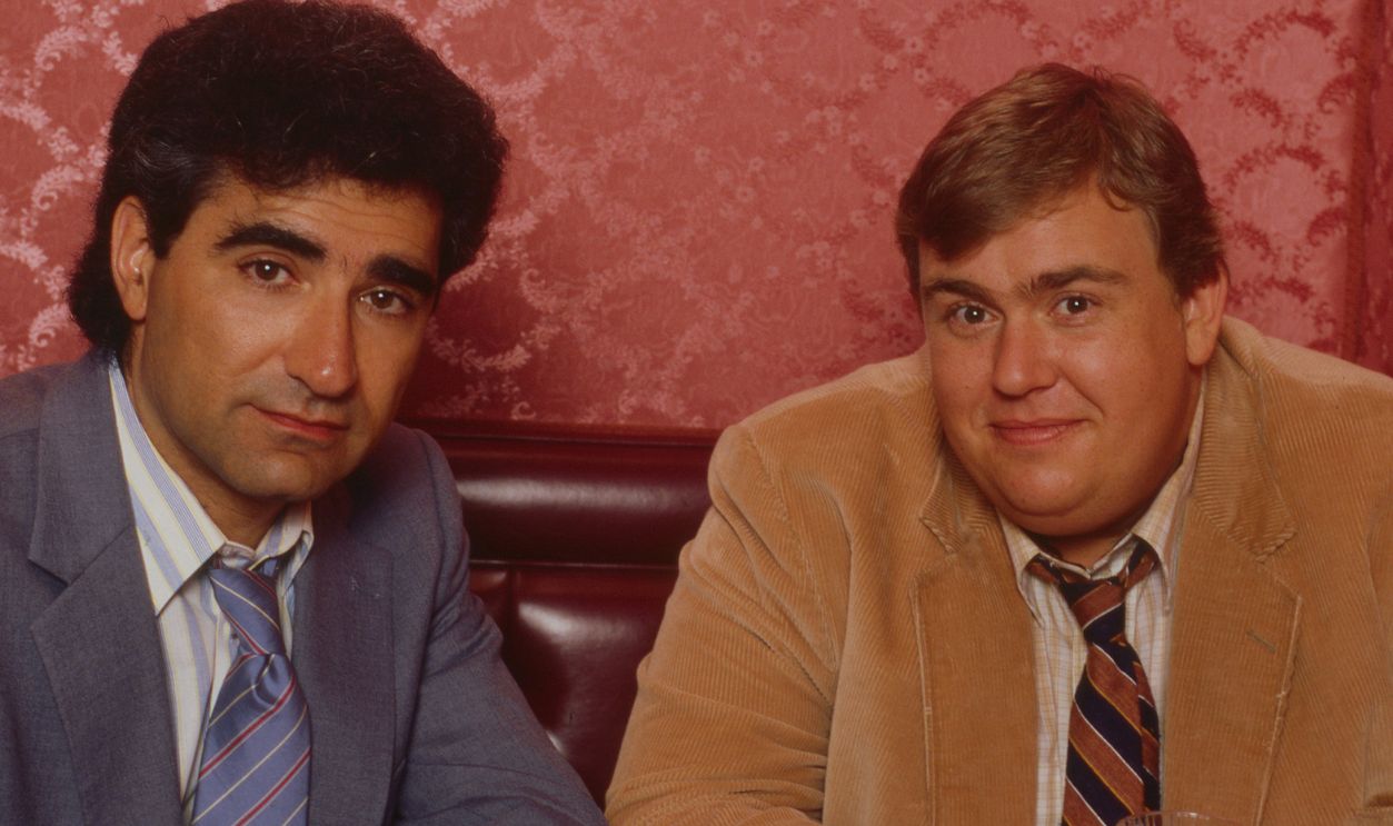 Promotional portrait of Canadian actors Eugene Levy (left) and John Candy (1950 - 1994) in costume for the film 'Armed and Dangerous' (directed by Mark L Lester), Los Angeles, California, 1985. 