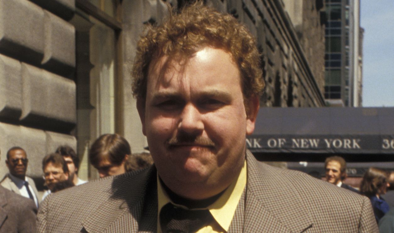 Actor John Candy being photoraphed on location filming 'Bright Lights, Big City' on April 14, 1987 in New York City, New York.