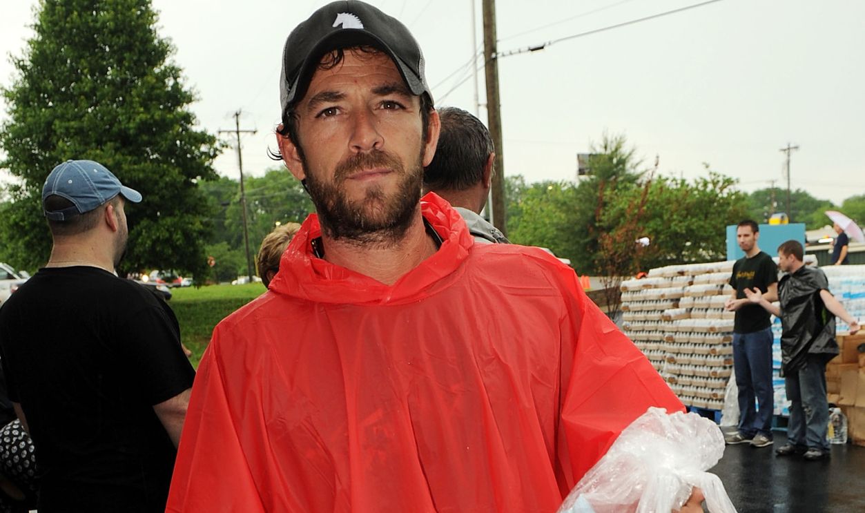During lightening, hail and flash flood warnings Actor Luke Perry, part time Middle Tennessee resident volunteers with Soles4souls Inc.to bring relief to Nashville flood victims at Soles4Souls Inc. on May 14, 2010 in Nashville, Tennessee.