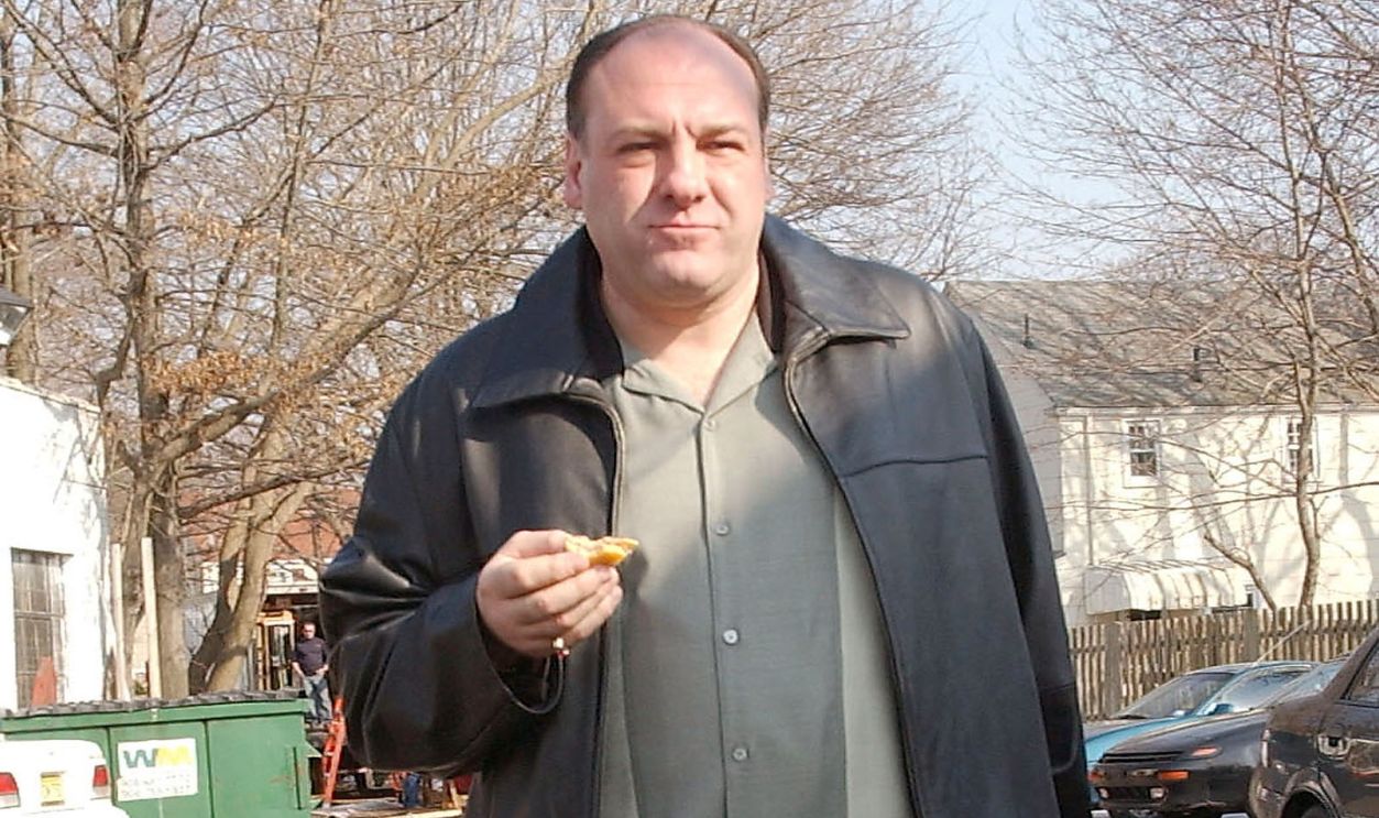 Actor James Gandolfini eats while on site for the filming of the final episode of 