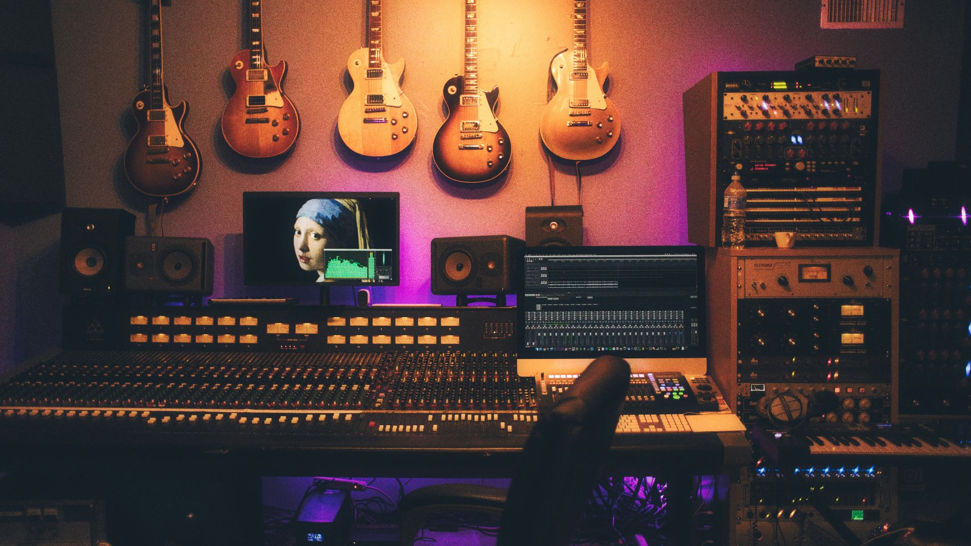 person playing brown and white acoustic guitars