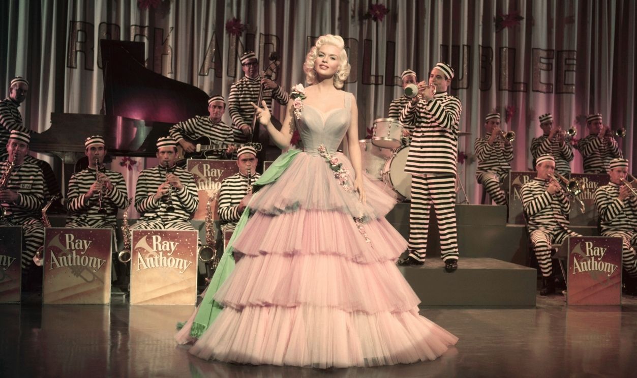 The Girl The Girl Can't Help It Jayne Mansfield sings in front of the Ray Anthony Orchestra in a scene from the 1956 musical comedy.