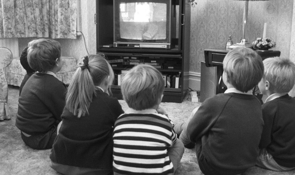A group of young British children watching television in October 1988.