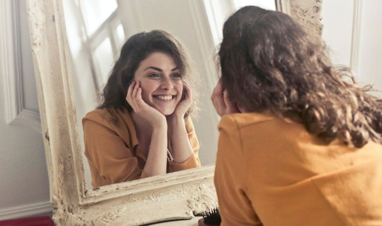 Woman looking in the mirror