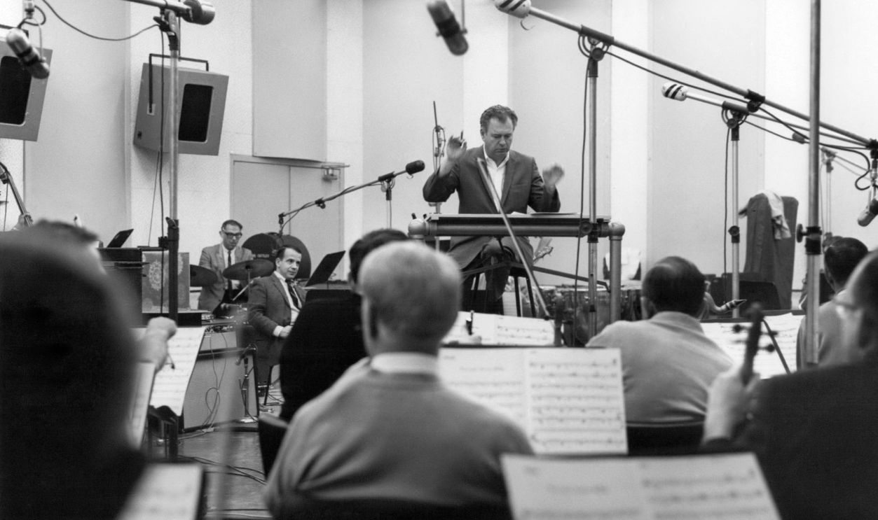 Nelson Riddle In Studio American arranger, composer and bandleader Nelson Riddle (1921 - 1985) conducts an orchestra in a studio, circa 1965.