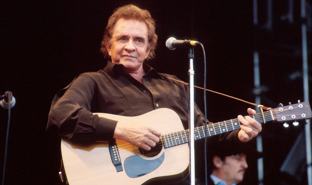 Johnny Cash performs on stage at Glastonbury Festival, June 1994. 