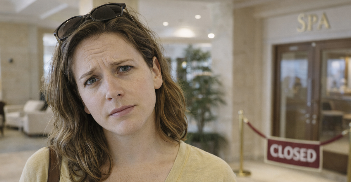 Woman frustrated by spa closure at luxury resort