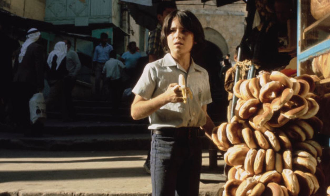 Brandon Cruz stands outside a gate in 'Old City' 