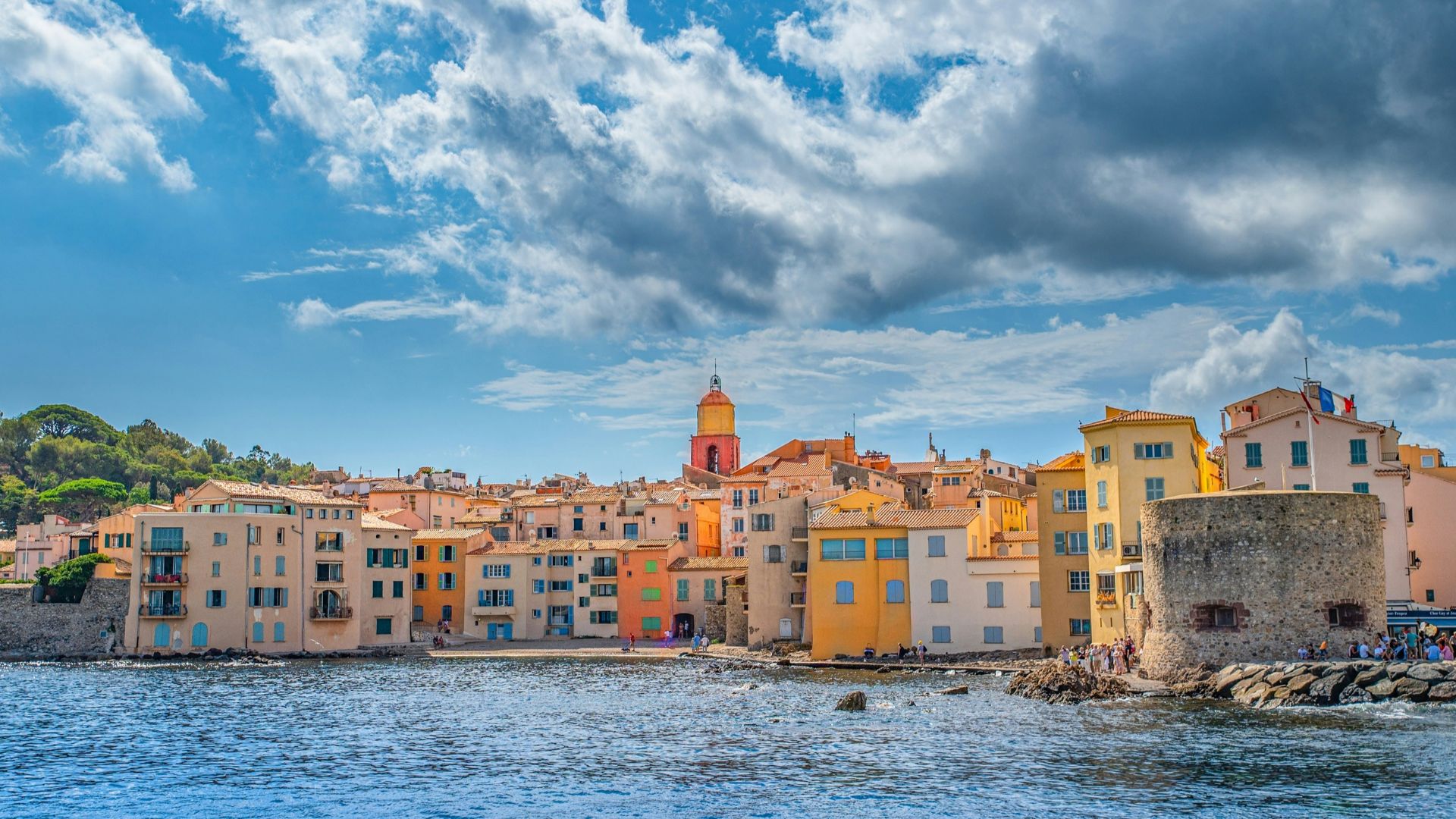a group of buildings next to a body of water