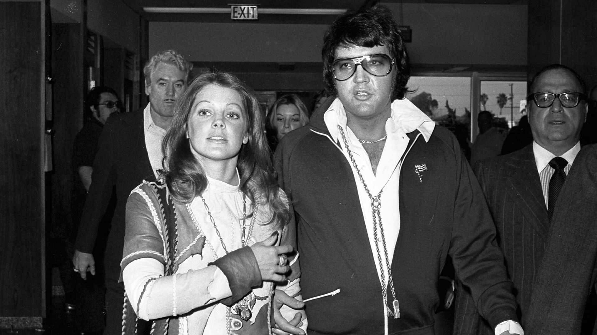 Elvis and Priscilla Presley leaving a courtroom in Santa Monica, California, after their divorce was finalized