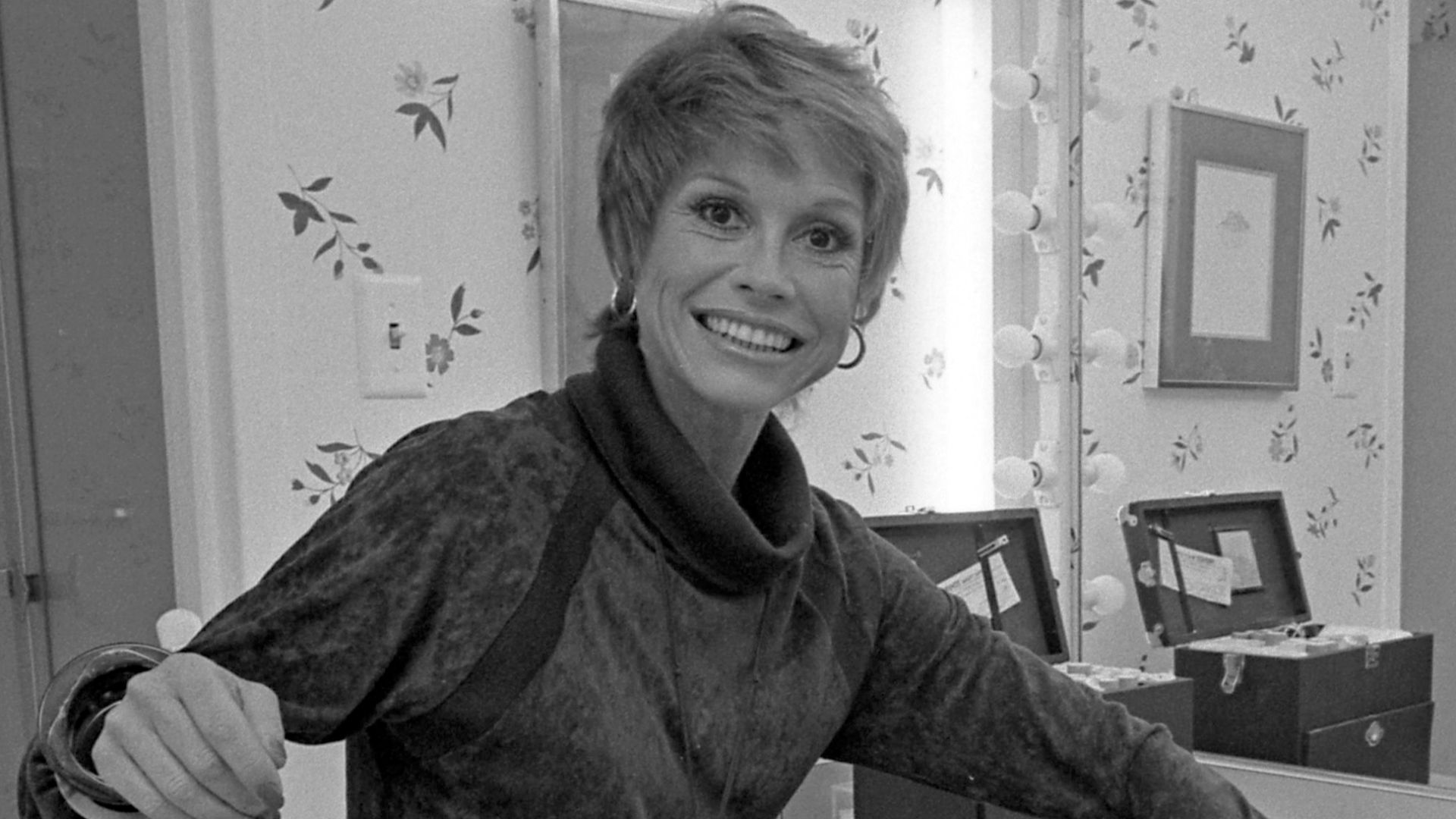 Actress Mary Tyler Moore sitting before dressing table
