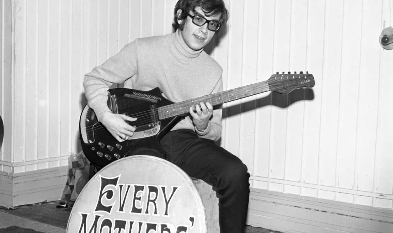 NEW YORK - NOVEMBER 8: Electric sitarist Dennis Larden of the rock and roll group "Every Mother's Son" poses for a portrait session for Danelectro Guitars holding an electric sitar at W. 27th St. Hall on November 8, 1967 in New York, New York. 