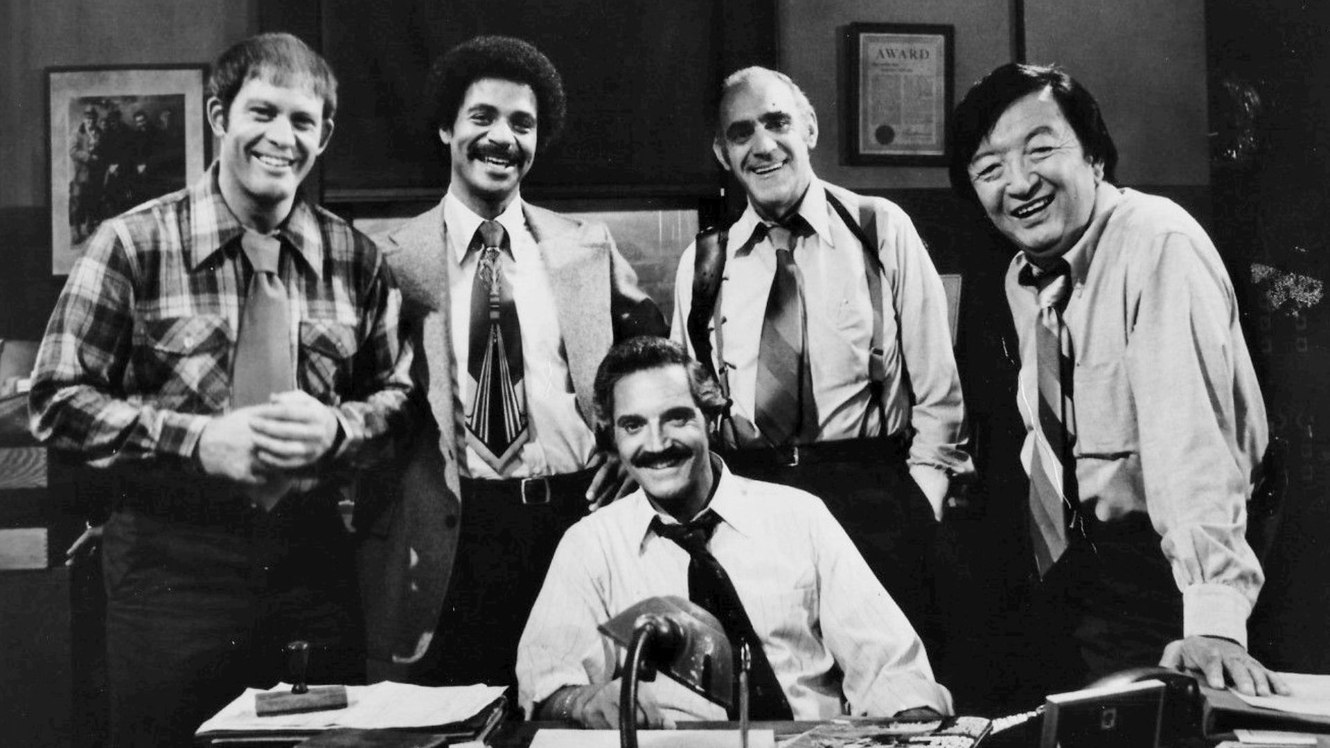 1977 cast photo from the television series Barney Miller.  From left: Max Gail (