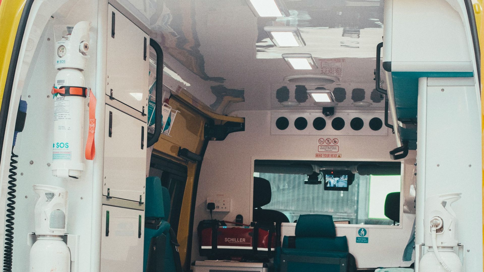 Interior view of an ambulance with medical equipment and stretcher
