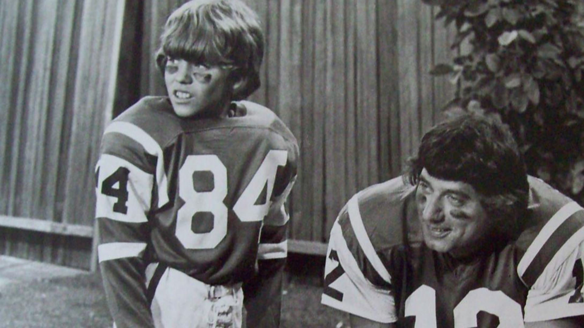 Photo of football player Joe Namath and Mike Lookinland (Bobby) from the television program The Brady Bunch.  When Bobby brags to his friends that he knows Joe Namath personally, he has to find a way to prove what he's been saying.