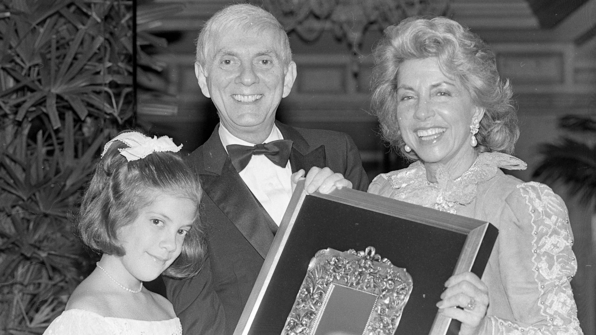 Aaron Spelling, with daughter Tori, left, was named Host of year by Toni Webb, Les Dames de Champagne president. Mrs. Spelling was absent because of an illness.