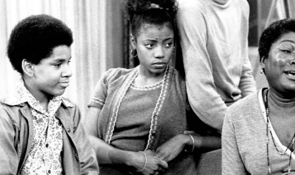Photo of the Evans family from the television program Good Times.  From left: Ralph Carter (Michael), BernNadette Stanis (Thelma), Jimmie Walker (J.J.), Esther Rolle (Florida), John Amos (James).