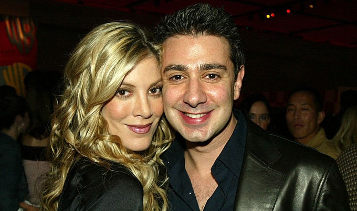 LOS ANGELES - JANUARY 13: Actress Tori Spelling (L) and her fiance, Charlie Shanian, pose at The WB Television Network's All-Star Winter TCA Party at the Annex at Hollywood and Highland on January 13, 2004 in Los Angeles, California.