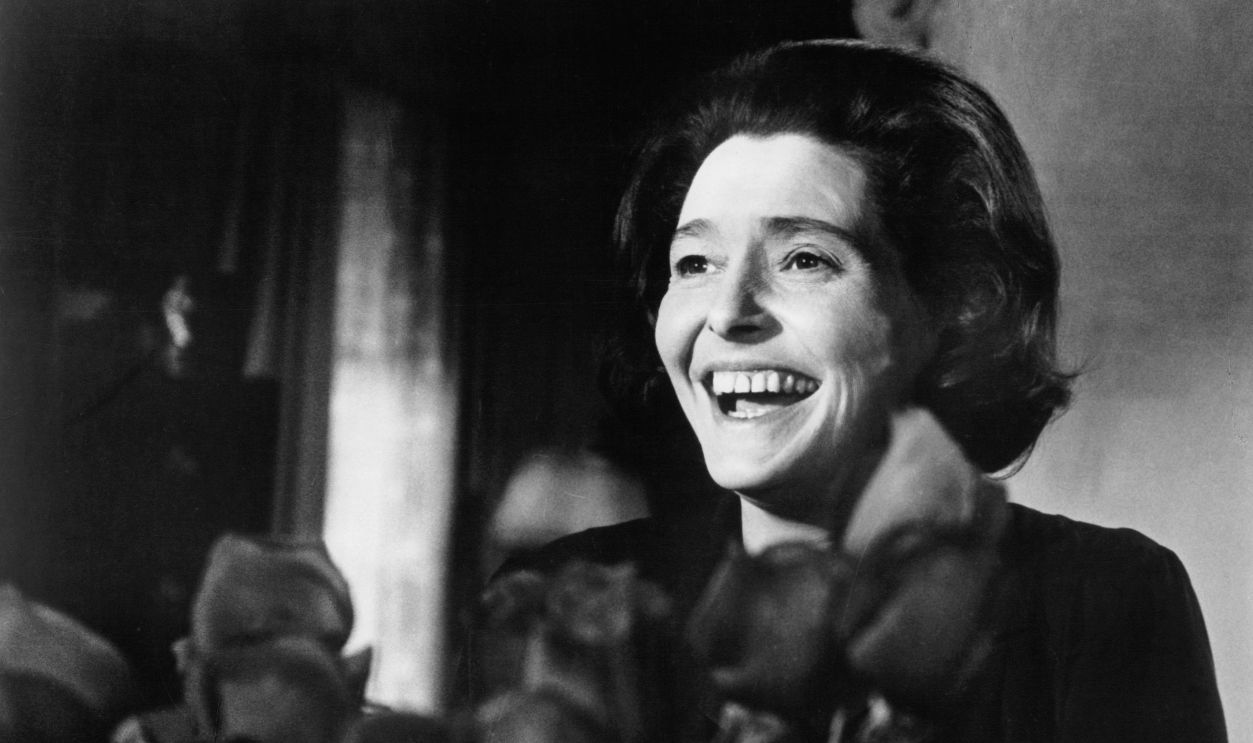 Patricia Neal is delighted over the gift of roses given to her she thinks by her husband in a scene from the film 'The Subject Was Roses