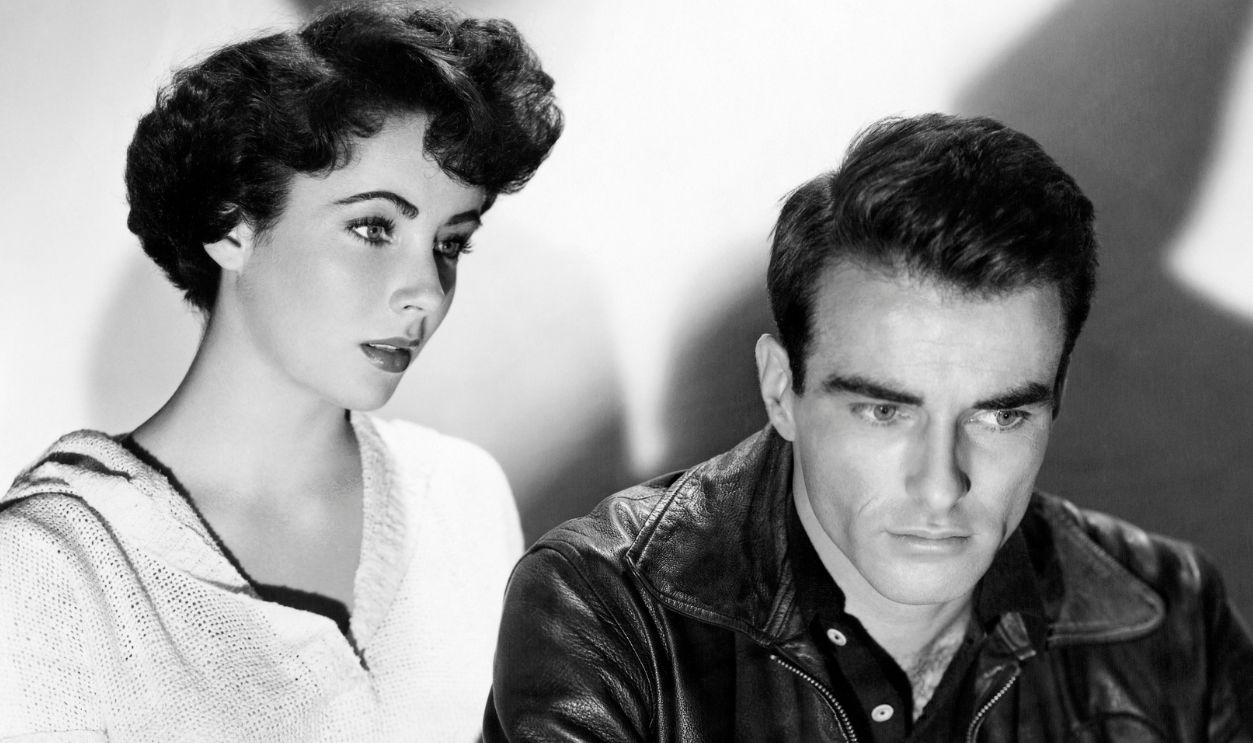 Actress Elizabeth Taylor plays Angela Vickers alongside Montgomery Clift's character George Eastman in the 1951 film A Place in the Sun.