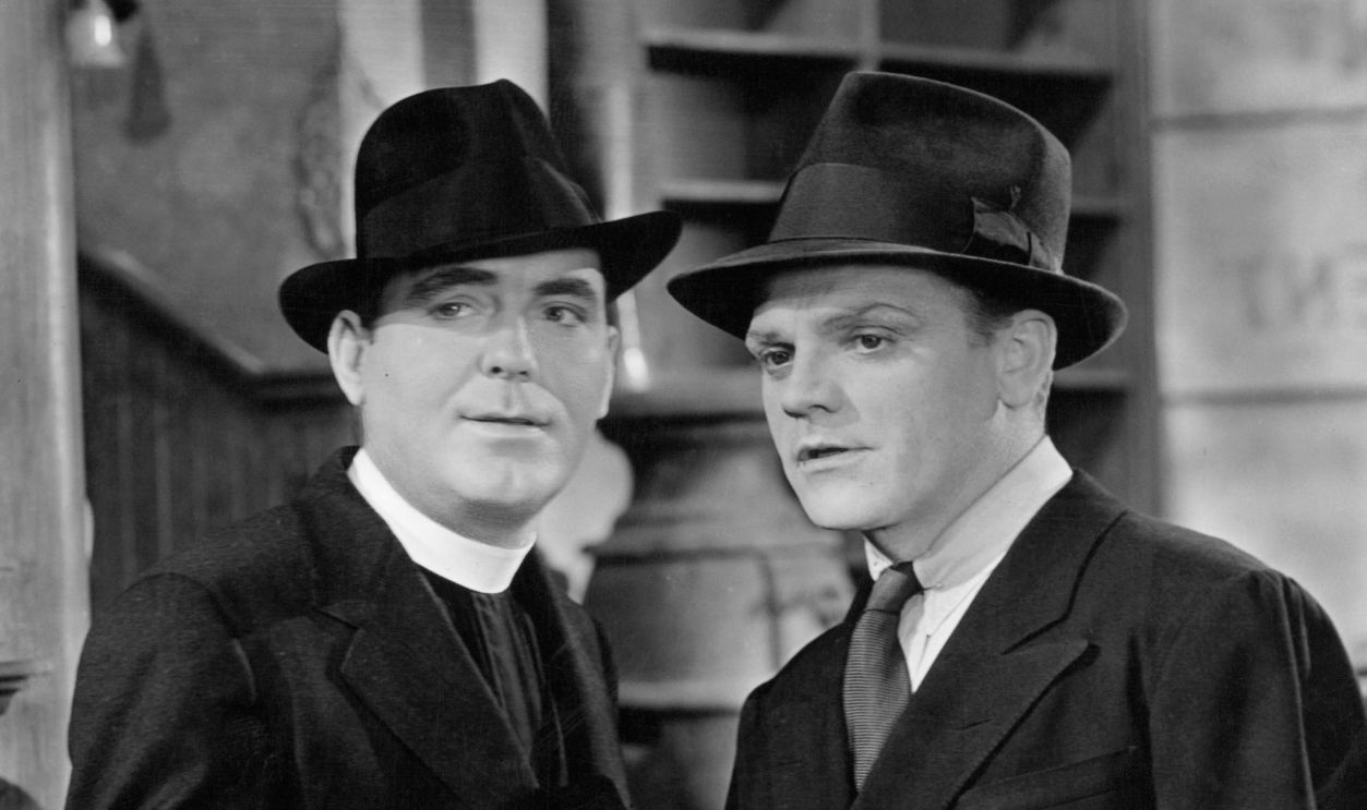 Pat O'Brien and James Cagney looking ahead in the distance in a scene from the film 'Angels With Dirty Faces', 1938. 