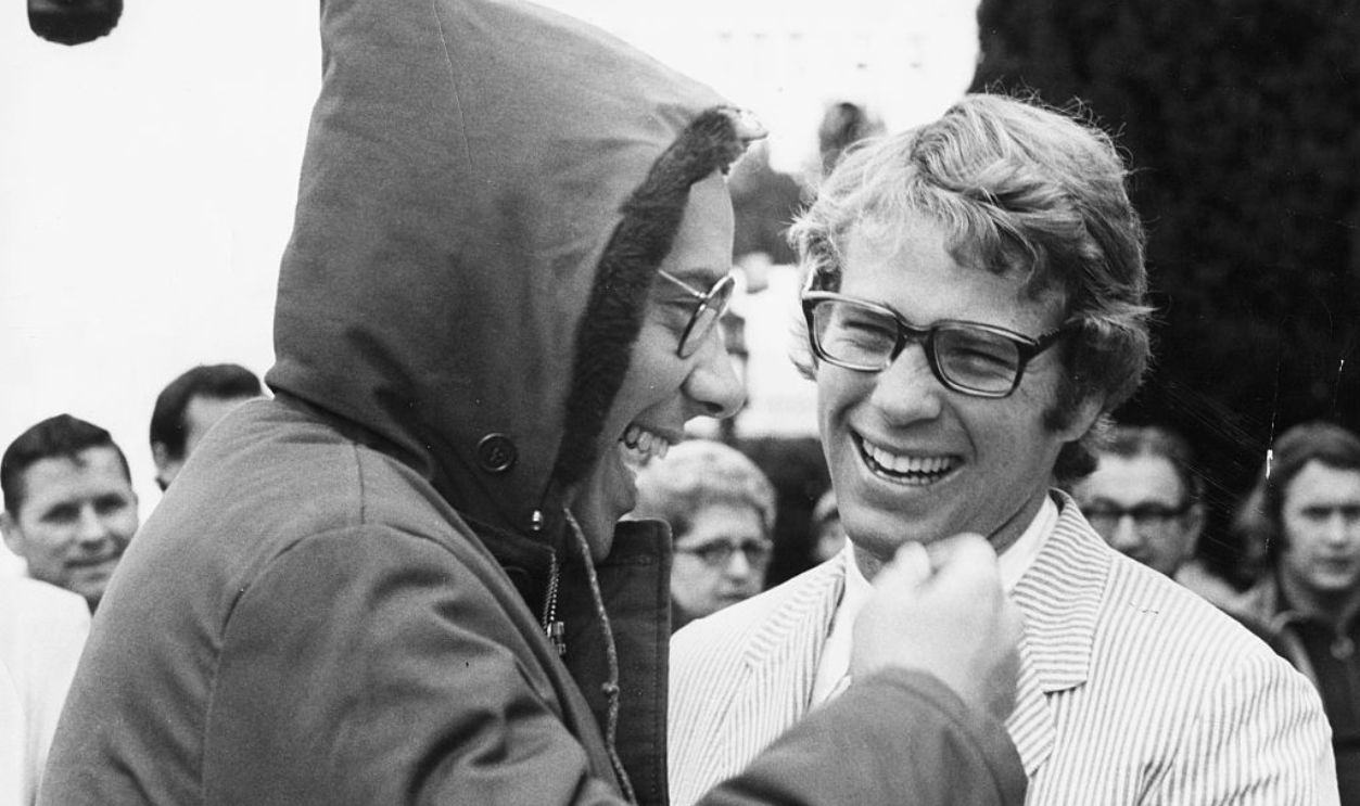 Director Peter Bogdanovich (left) and actor Ryan O'Neal, laughing together on the set of the movie 'What's Up Doc?', San Francisco, CA, circa 1971.